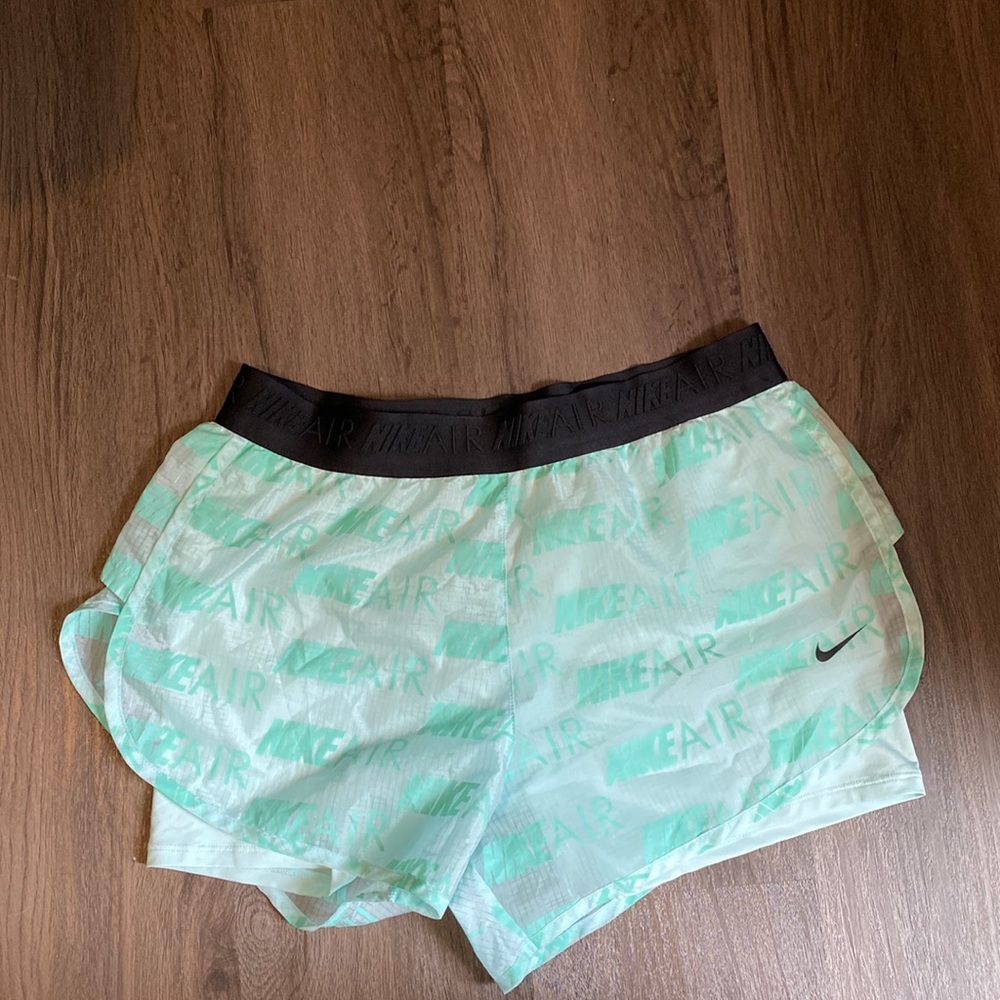 Teal Nike shorts with spandex underneath